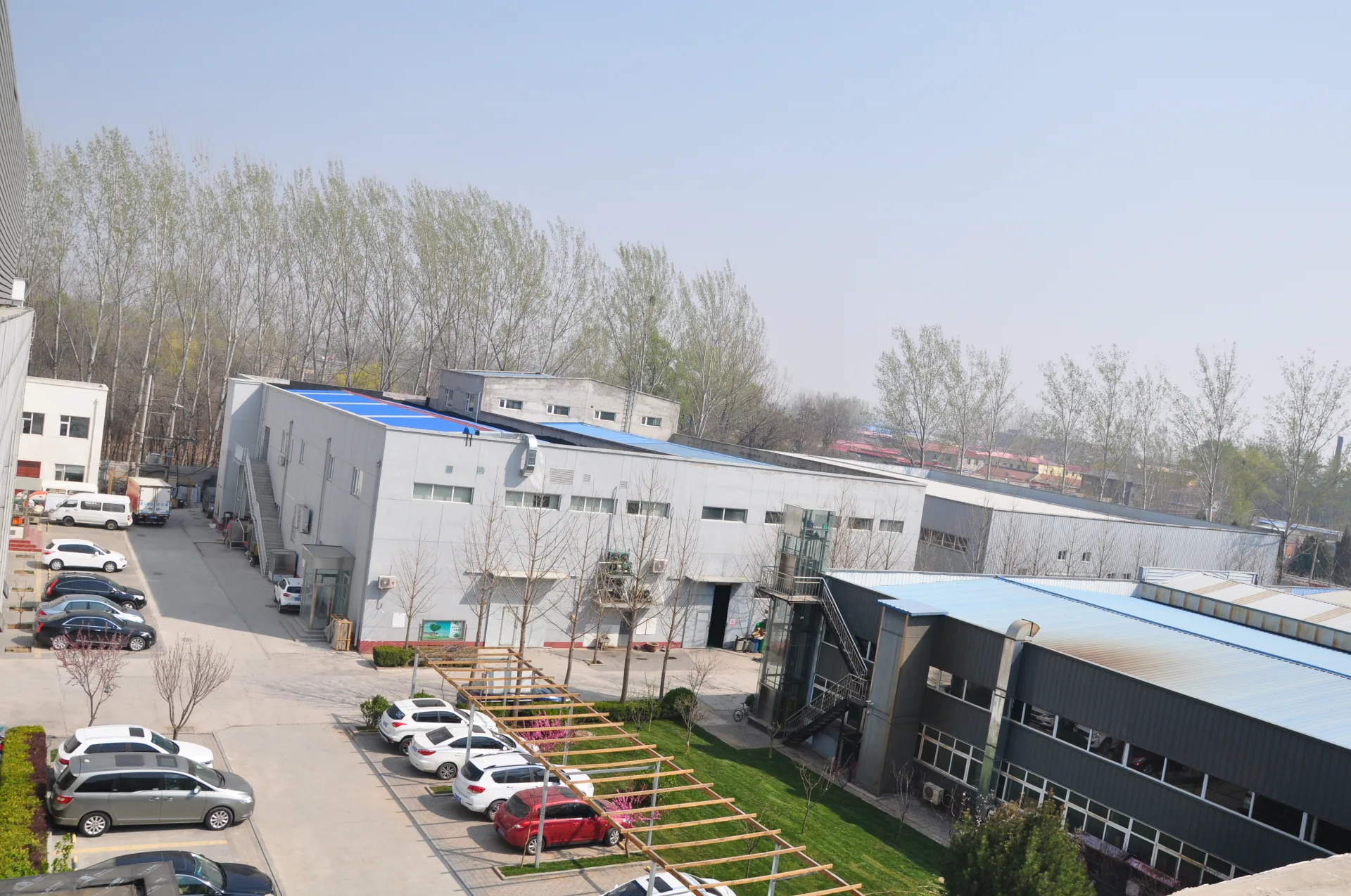 Workshop buildings and the factory yard viewed from an elevated position.