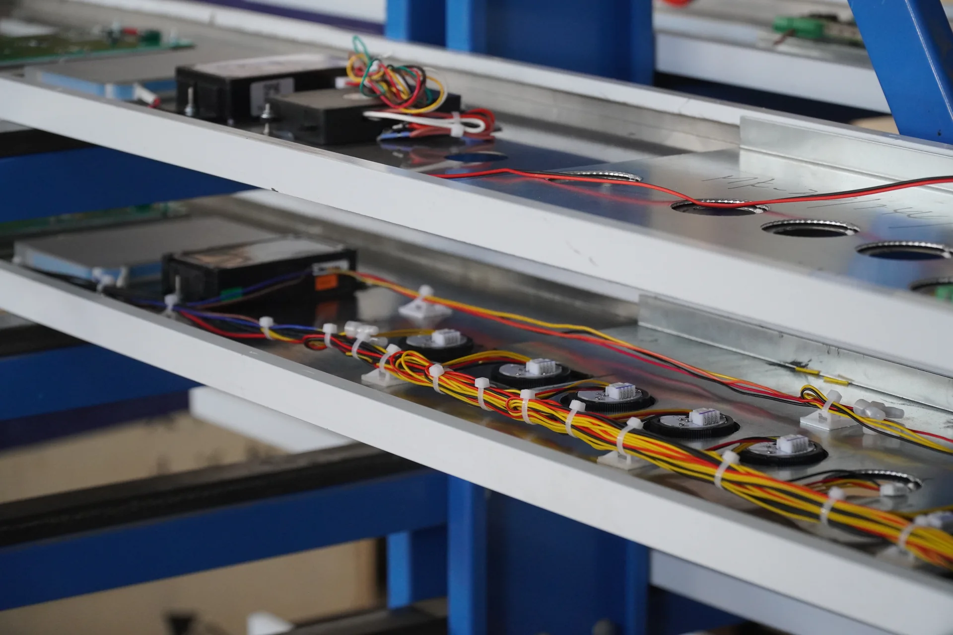 Button modules and wiring on the backs of elevator operating panels