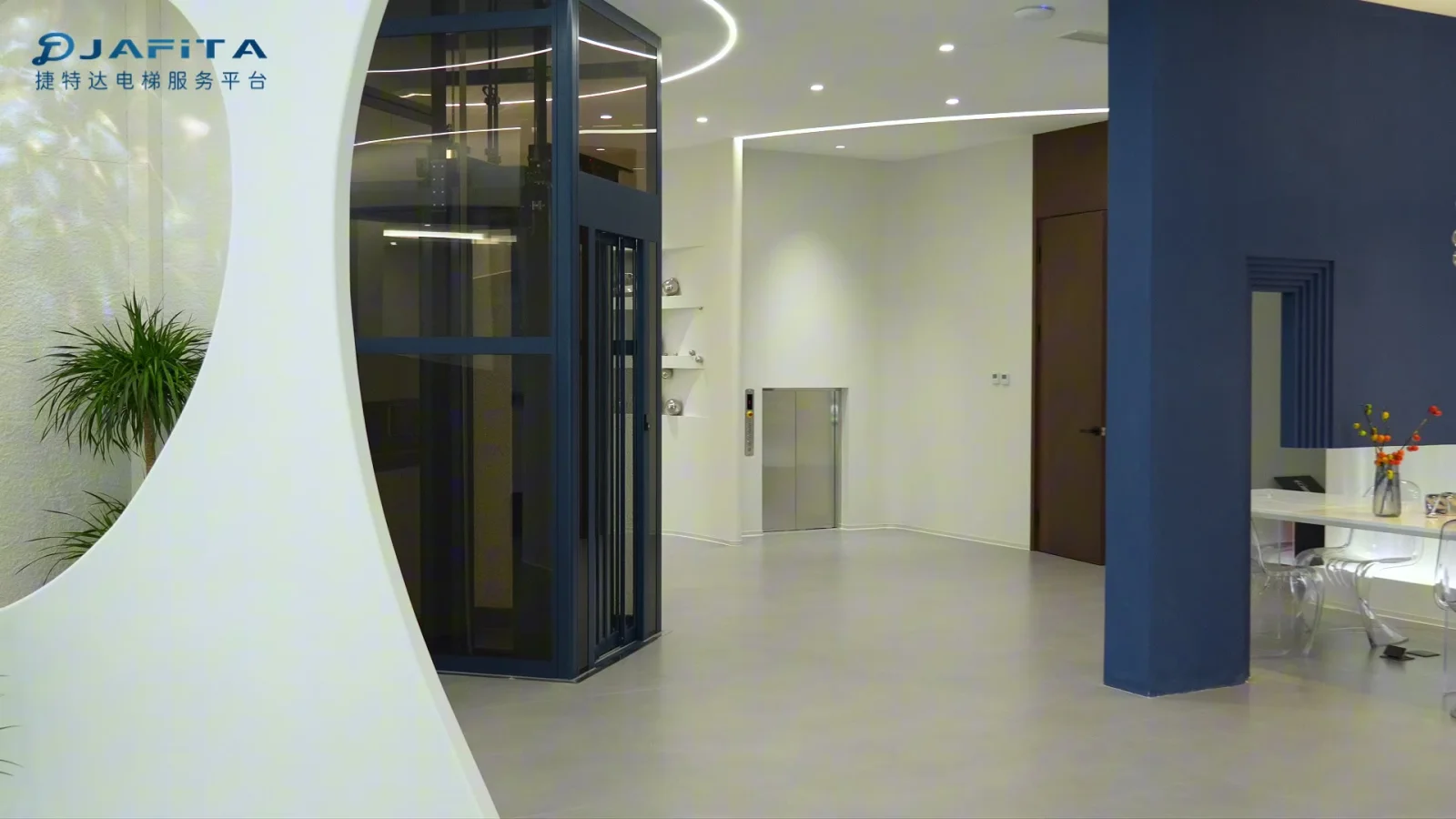 Blue framed glass elevator and consultation area in the Beijing showroom, with the original JAFITA watermark